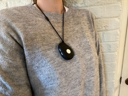 A mobile medical alert system worn as a necklace.