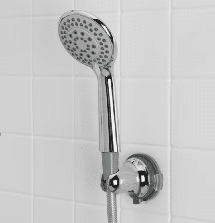 handheld shower head with wall bracket attached to shower wall