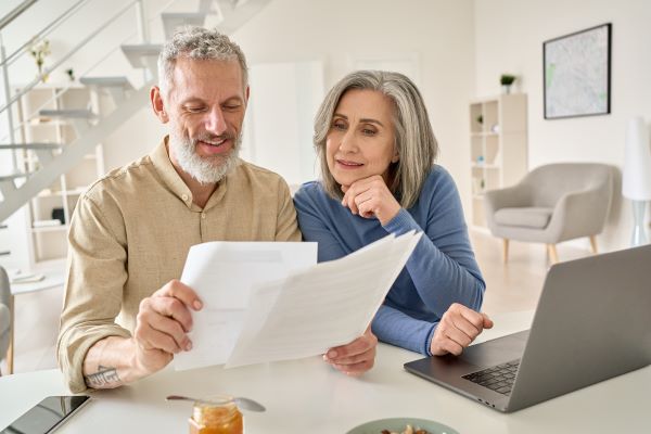 Couple preparing documents together at home