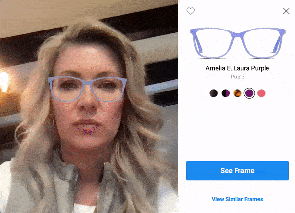 A user testing the live-mirror try-on feature from GlassesUSA.