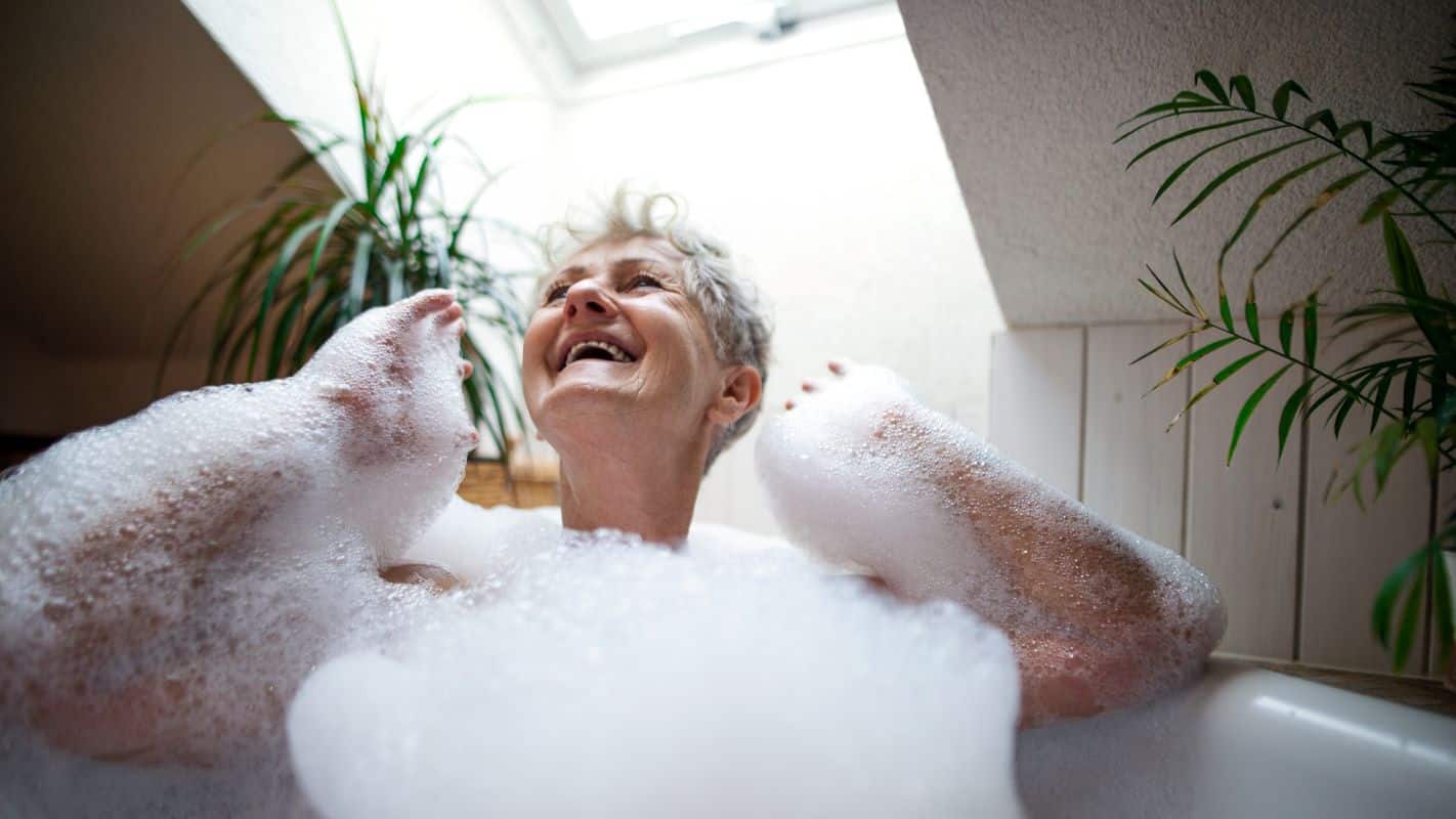 happy older woman bathing