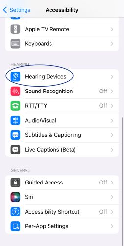 Screenshot of iPhone Settings Accessibility page with Hearing Devices circled