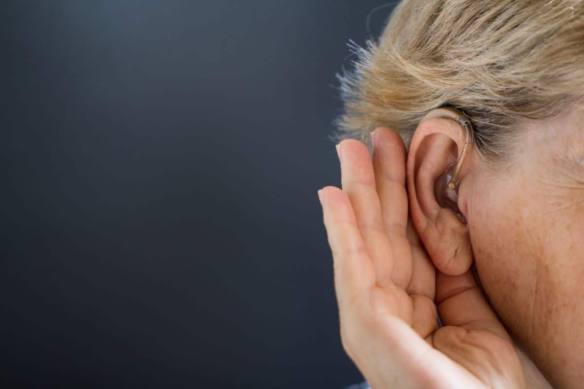 Close up photo of a person's ear with hearing aid
