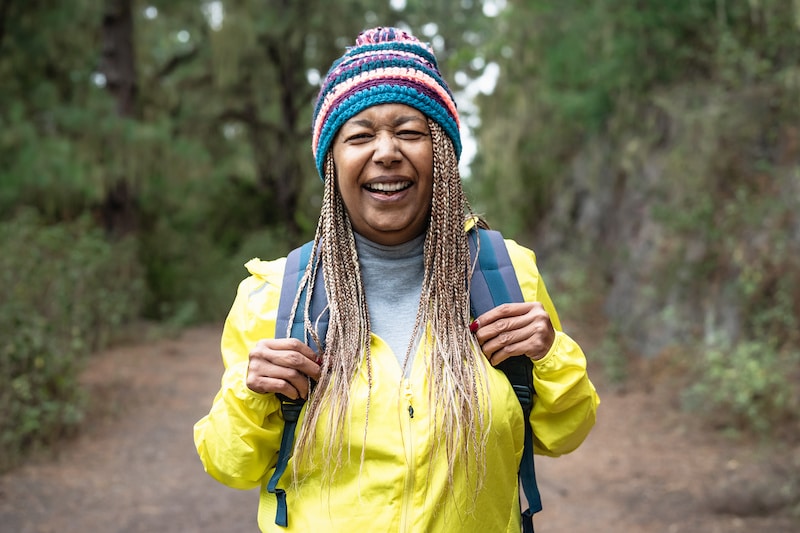 active woman smile while hiking best travel cpap
