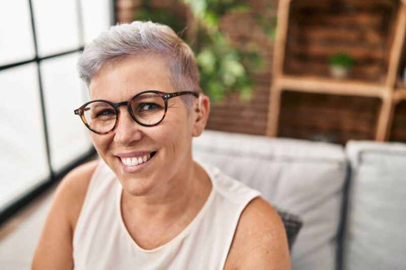 Person smiling wearing hearing aids