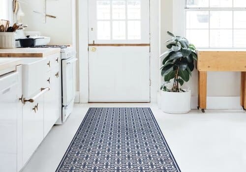 A vinyl rug used in a kitchen area
