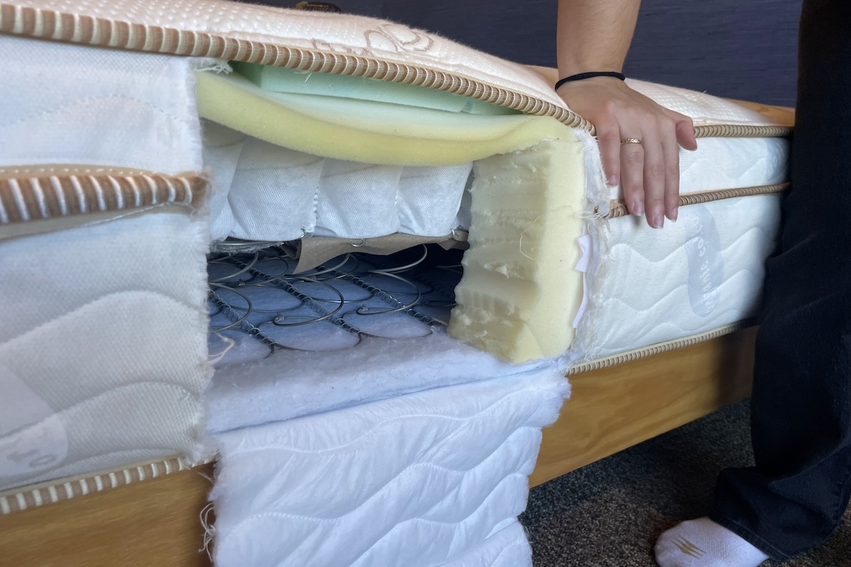 Saatva Classic mattress cut open to reveal the layers of foam and spring coils inside