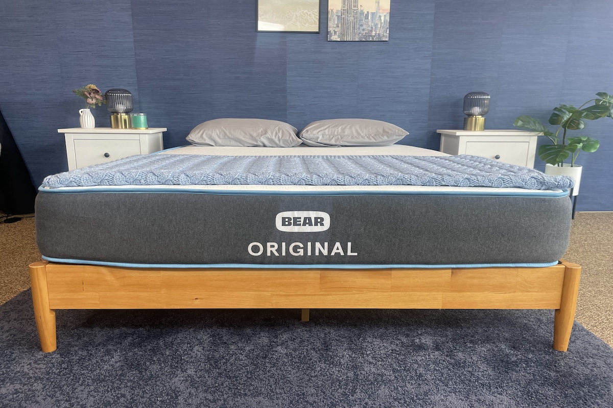 Original mattress on a wooden base in a bedroom setting located in our testing facility.