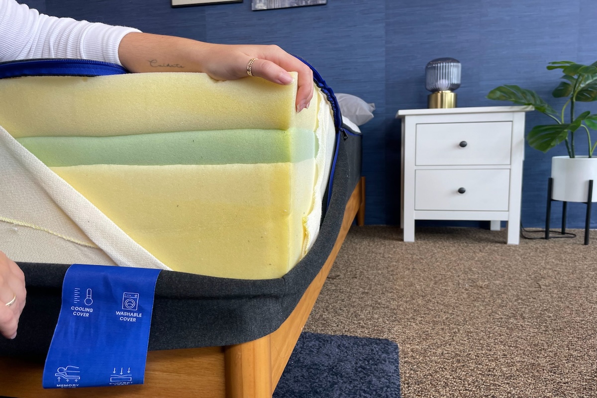 Tester shows a corner of The Nectar mattress’s interior composition