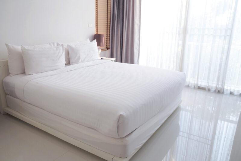 Hybrid mattress in bright, sunny bedroom