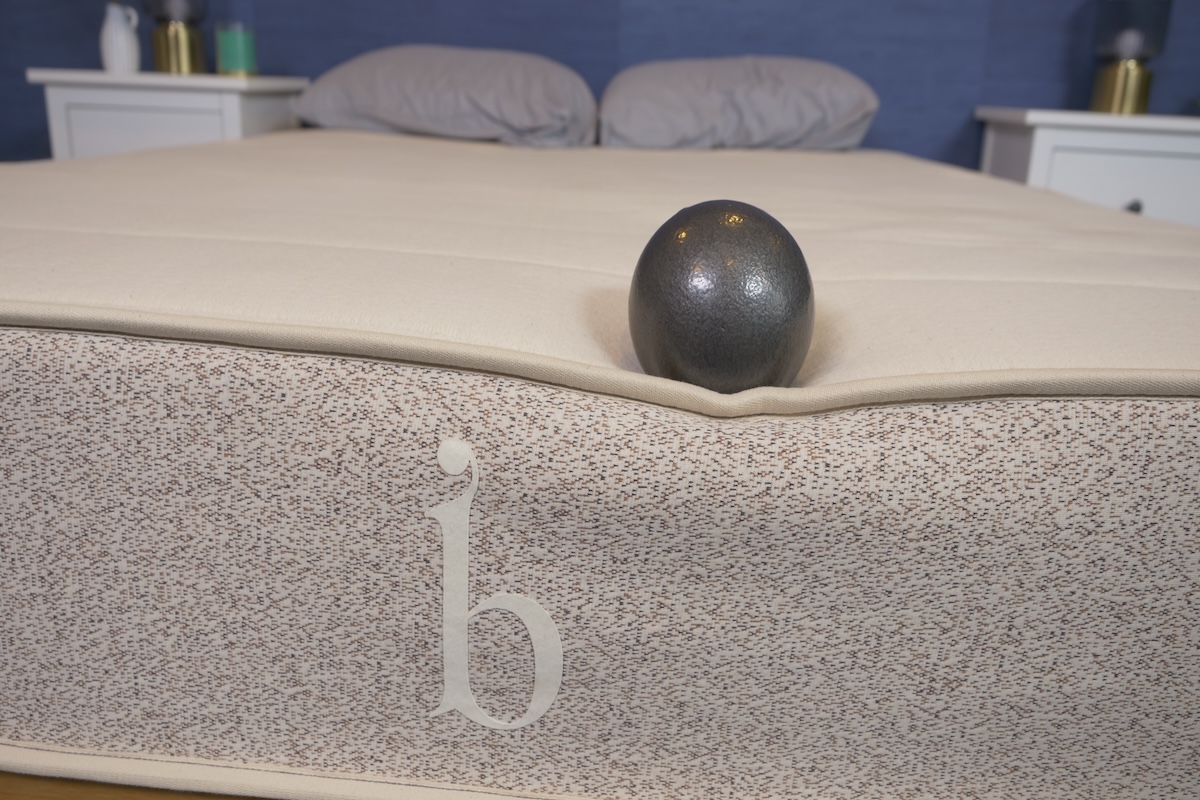 A 10-pound ball near the edge of a Birch mattress to showcase strong edge support. 