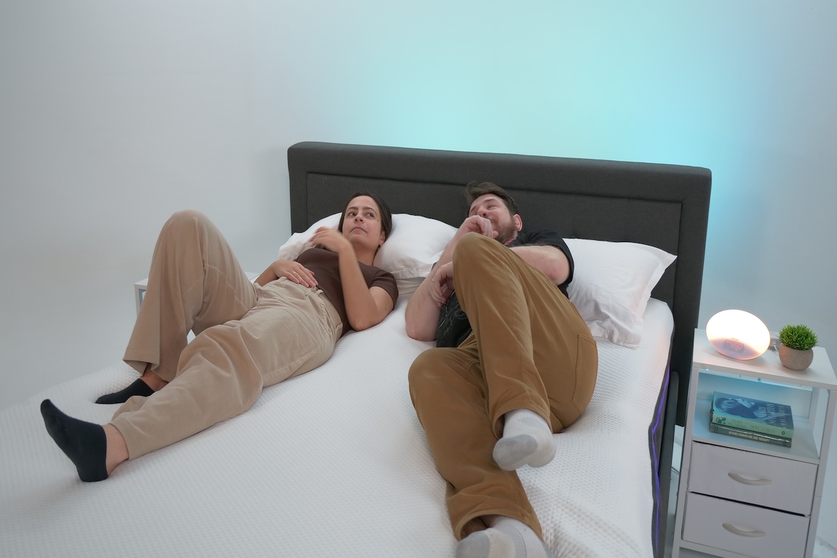 Two people lying on a Nectar Premier mattress