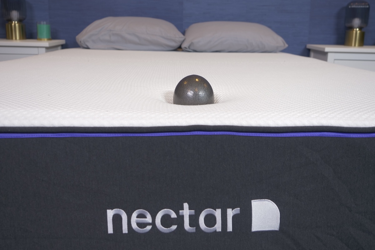 Weighted ball sinking into a Nectar mattress